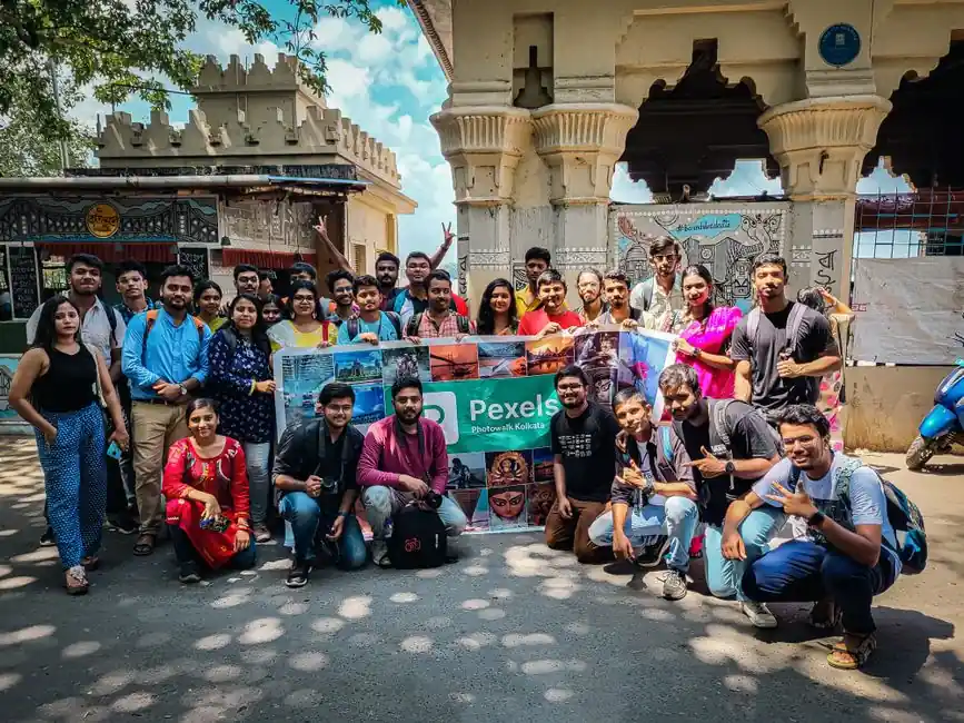 A vibrant group of tourists gathered for a Pexels photowalk in Kolkata, India.